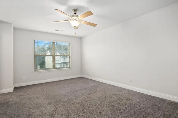a view of a house with a yard and porch