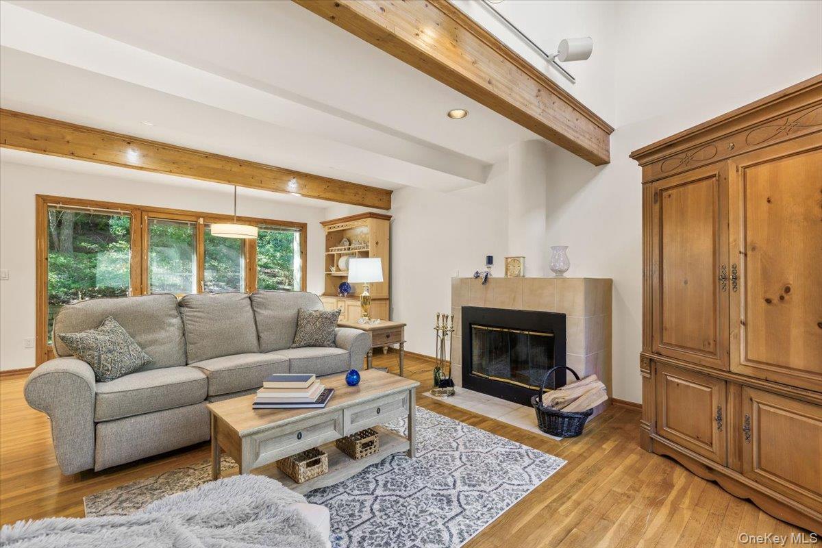 2 Deer Ridge Road Bedford Corners, NY 10549 - Photo 6 of 24 Spacious living room with vaulted ceilings and wood burning fireplace.