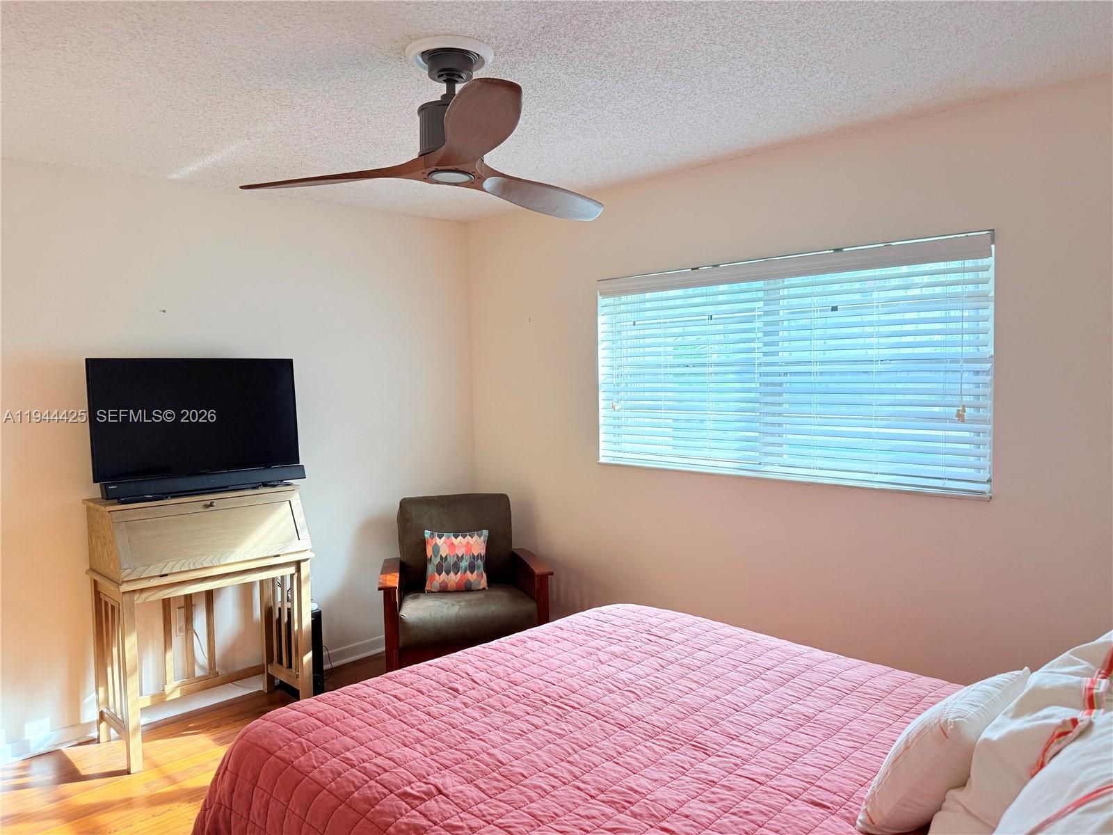 8951 North New River Canal Road, Unit 2D Plantation, FL 33324 - Photo 18 of 30 a bedroom with a bed and a television