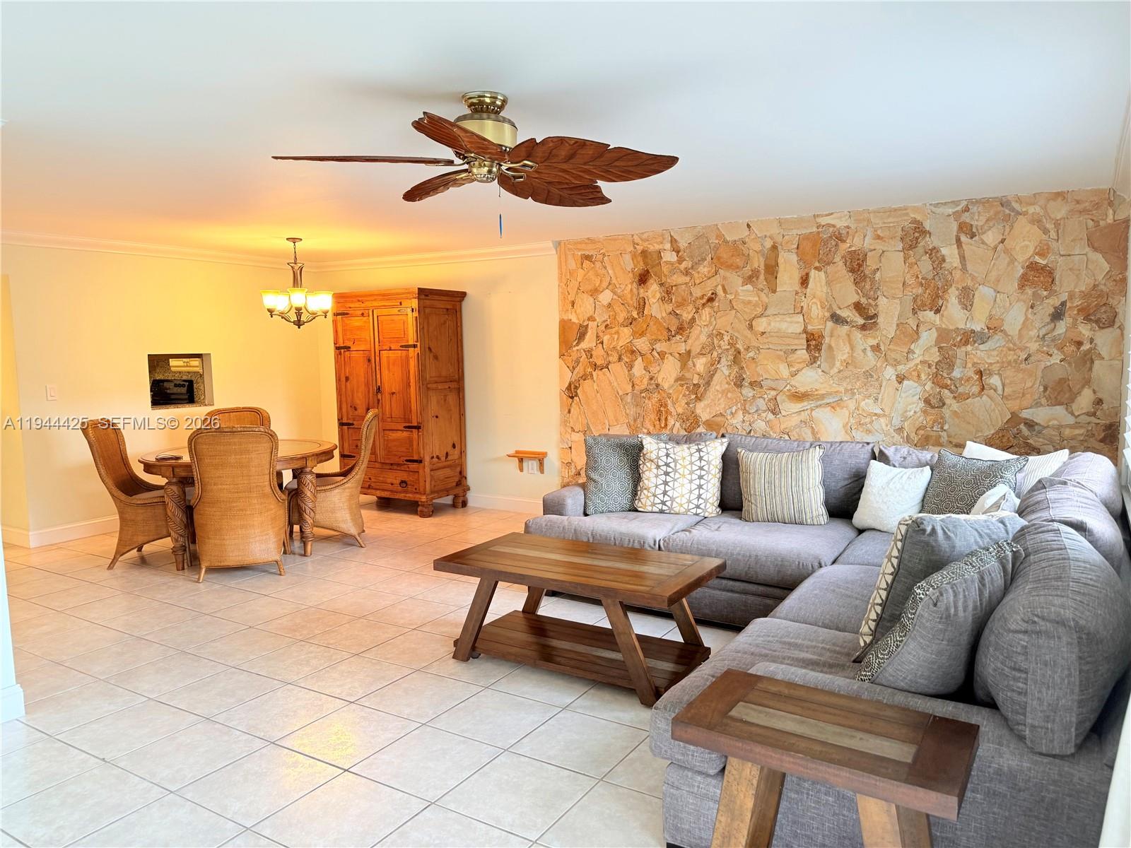 8951 North New River Canal Road, Unit 2D Plantation, FL 33324 - Photo 9 of 30 a living room with furniture and a large window