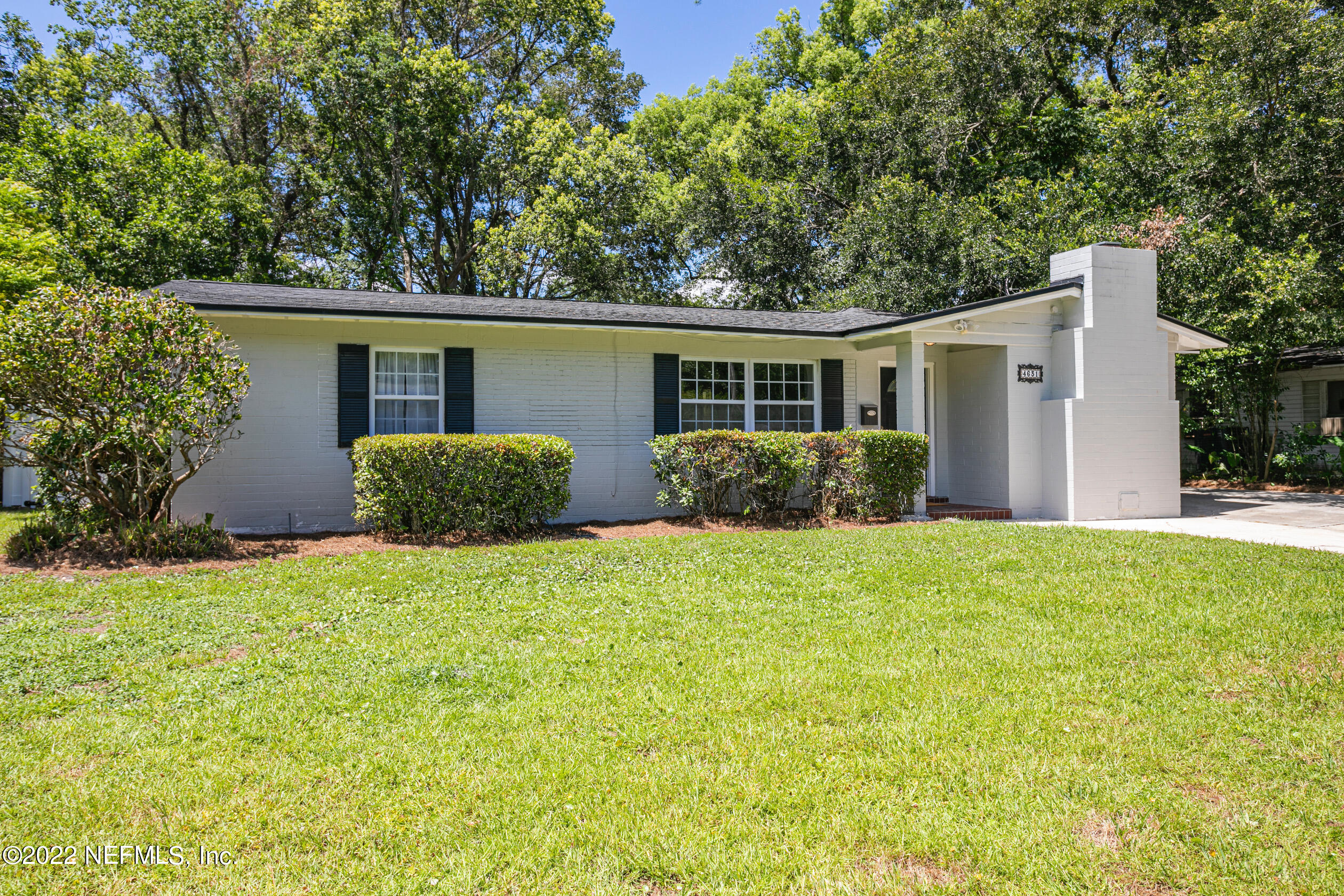 4631 Tanbark Road Jacksonville, FL 32210 - Photo 1 of 27 front view of a house with a yard