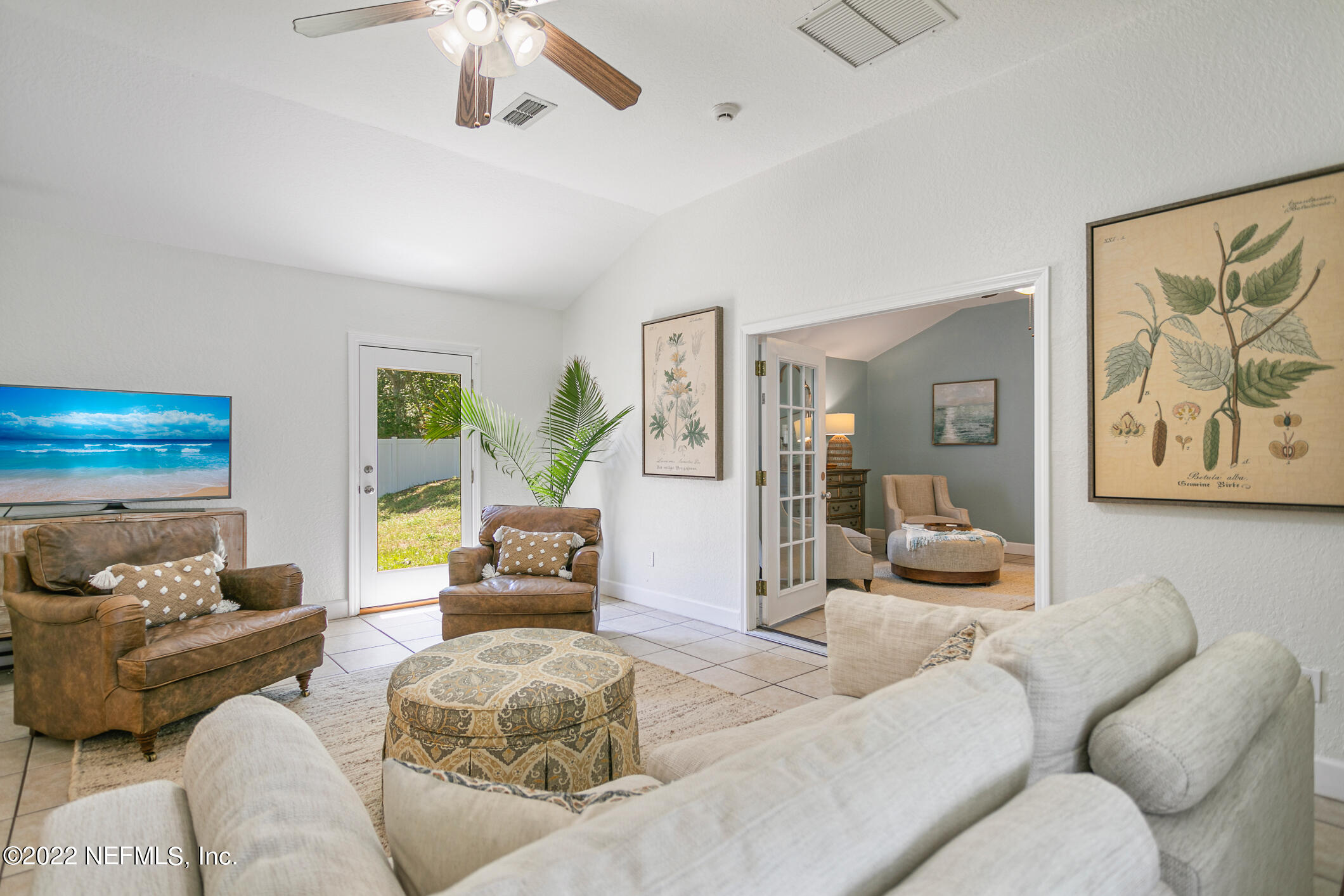 4631 Tanbark Road Jacksonville, FL 32210 - Photo 11 of 27 a living room with furniture and a large window