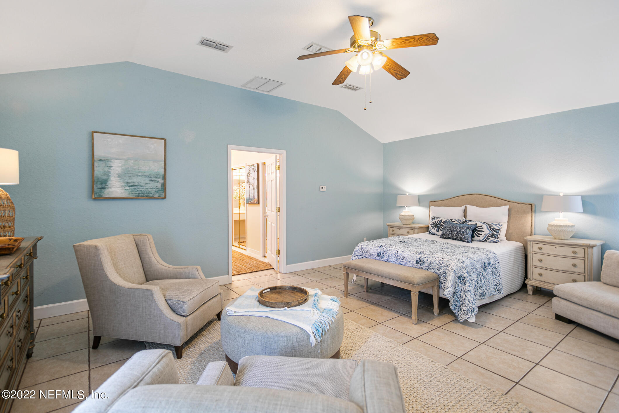 4631 Tanbark Road Jacksonville, FL 32210 - Photo 14 of 27 a bedroom with furniture and a chandelier