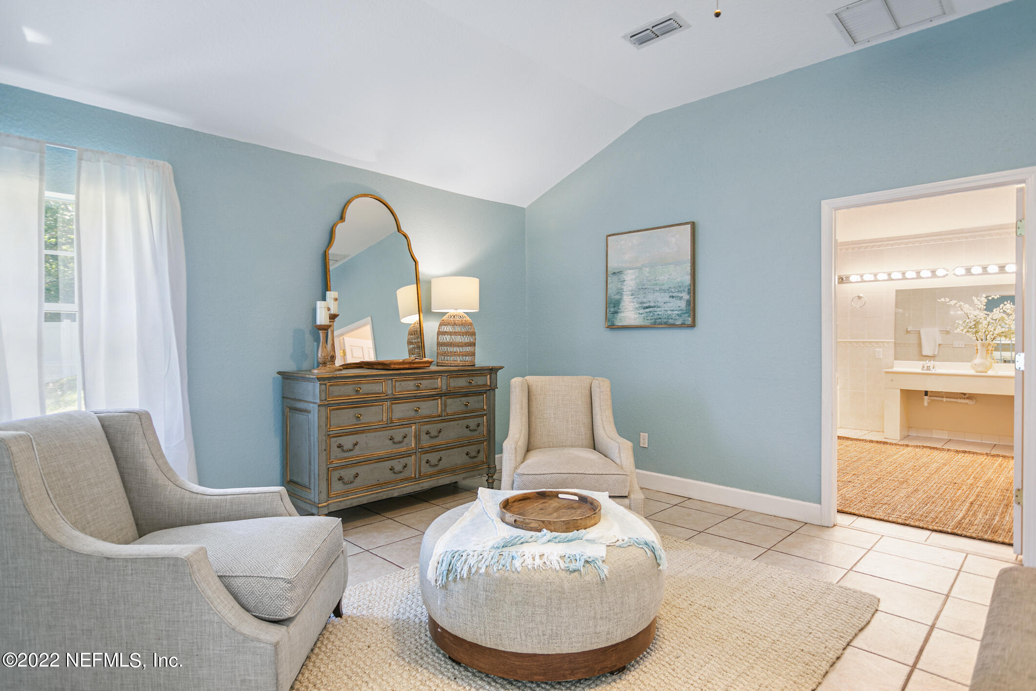 4631 Tanbark Road Jacksonville, FL 32210 - Photo 15 of 27 a living room with furniture and a mirror