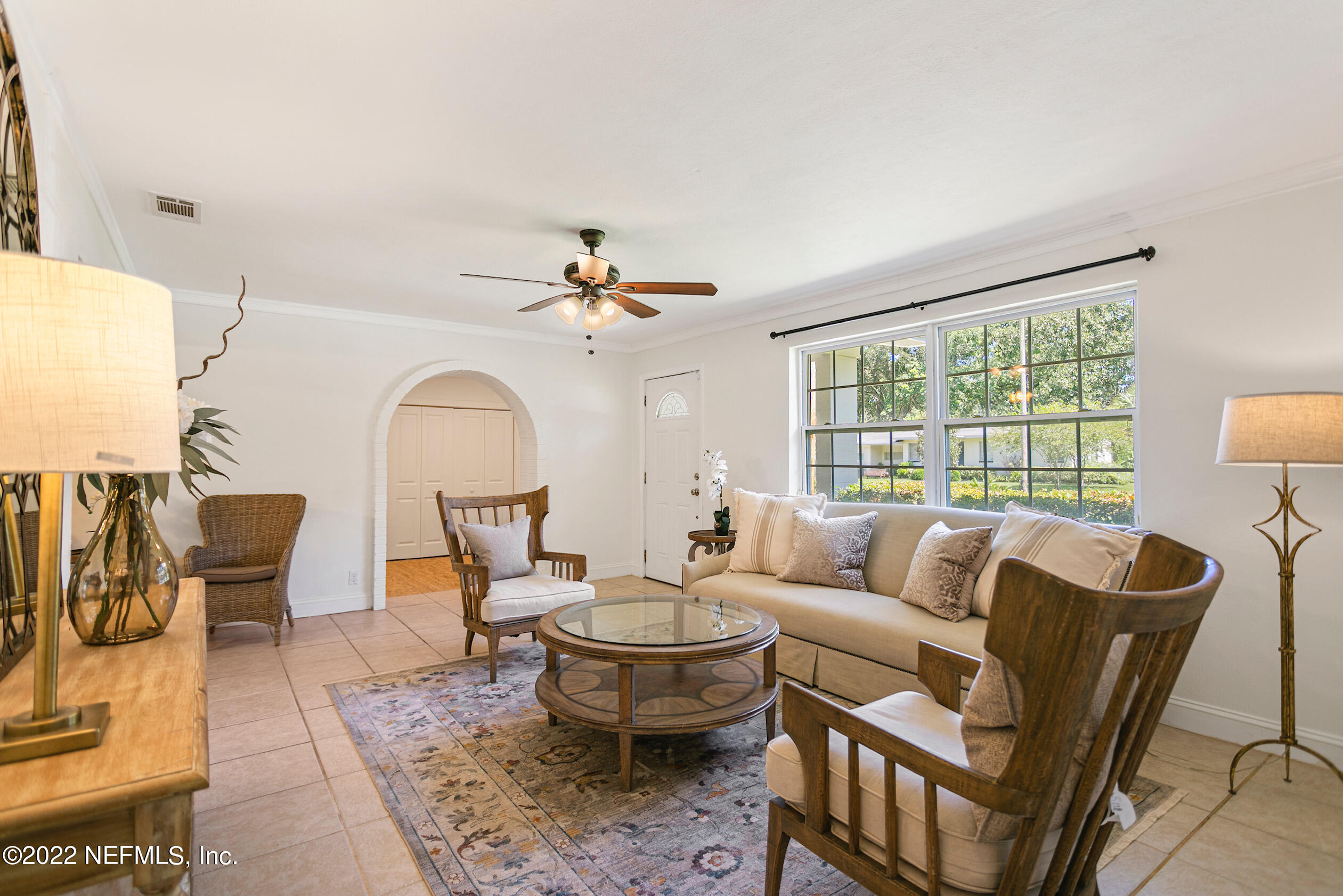 4631 Tanbark Road Jacksonville, FL 32210 - Photo 3 of 27 a living room with furniture and a large window
