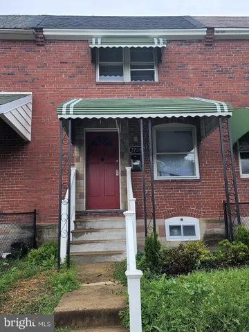 a front view of a house with a small yard
