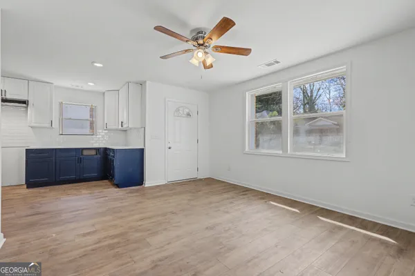 a kitchen with stainless steel appliances granite countertop a granite counter tops and a refrigerator