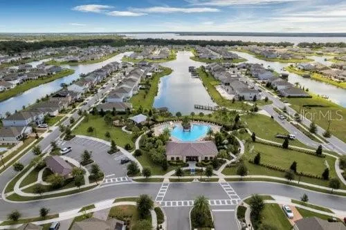 an aerial view of a residential houses with outdoor space