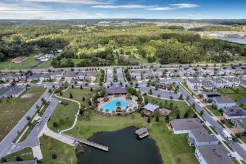 an aerial view of a house with a swimming pool