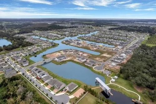 an aerial view of a house with a swimming pool
