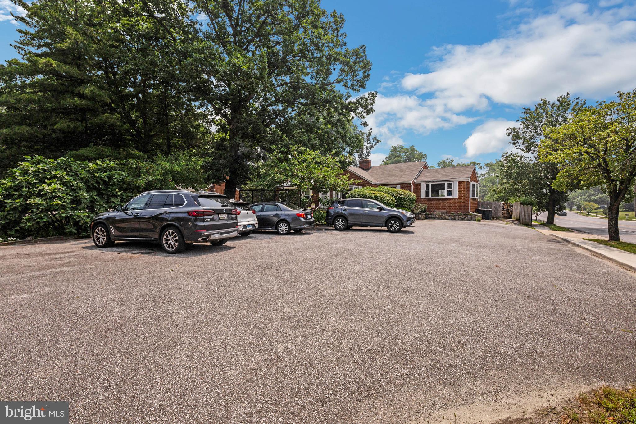 4906 St Barnabas Road Temple Hills, MD 20748 - Photo 3 of 52 10 car paved parking lot