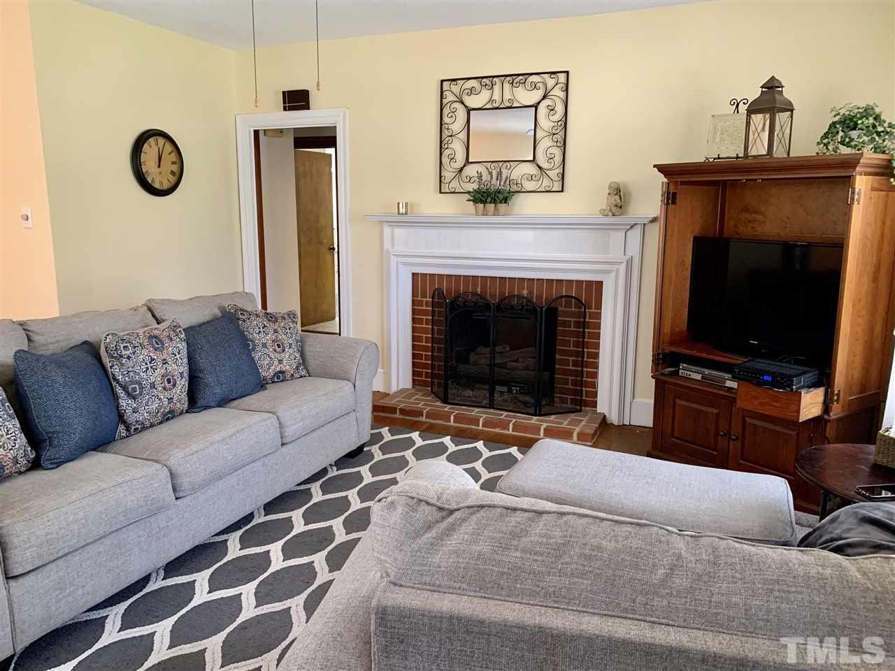 1445 Cole Mill Road Durham, NC 27705 - Photo 2 of 15 Open to Dining Area, Gas logs in fireplace