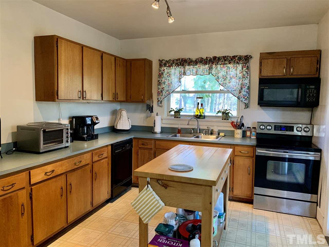1445 Cole Mill Road Durham, NC 27705 - Photo 4 of 15 Great space for cooking, center island will remain.