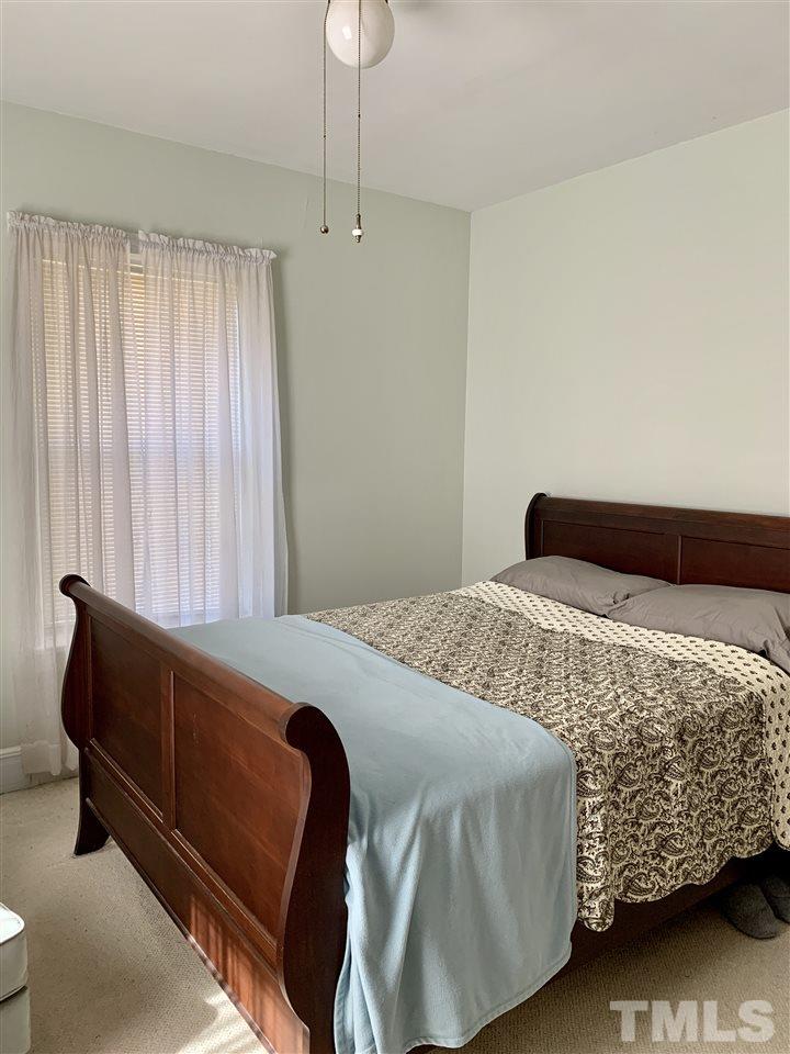 1445 Cole Mill Road Durham, NC 27705 - Photo 10 of 15 The larger bedroom has ceiling fan, double closet.