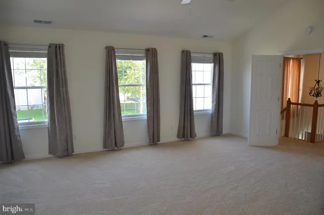 a view of empty room with windows