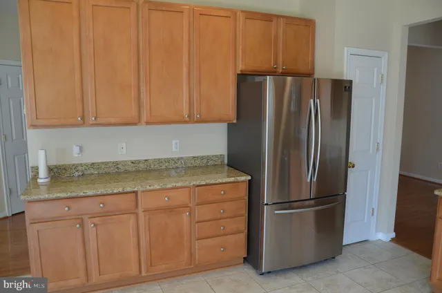 a kitchen with appliances and cabinets