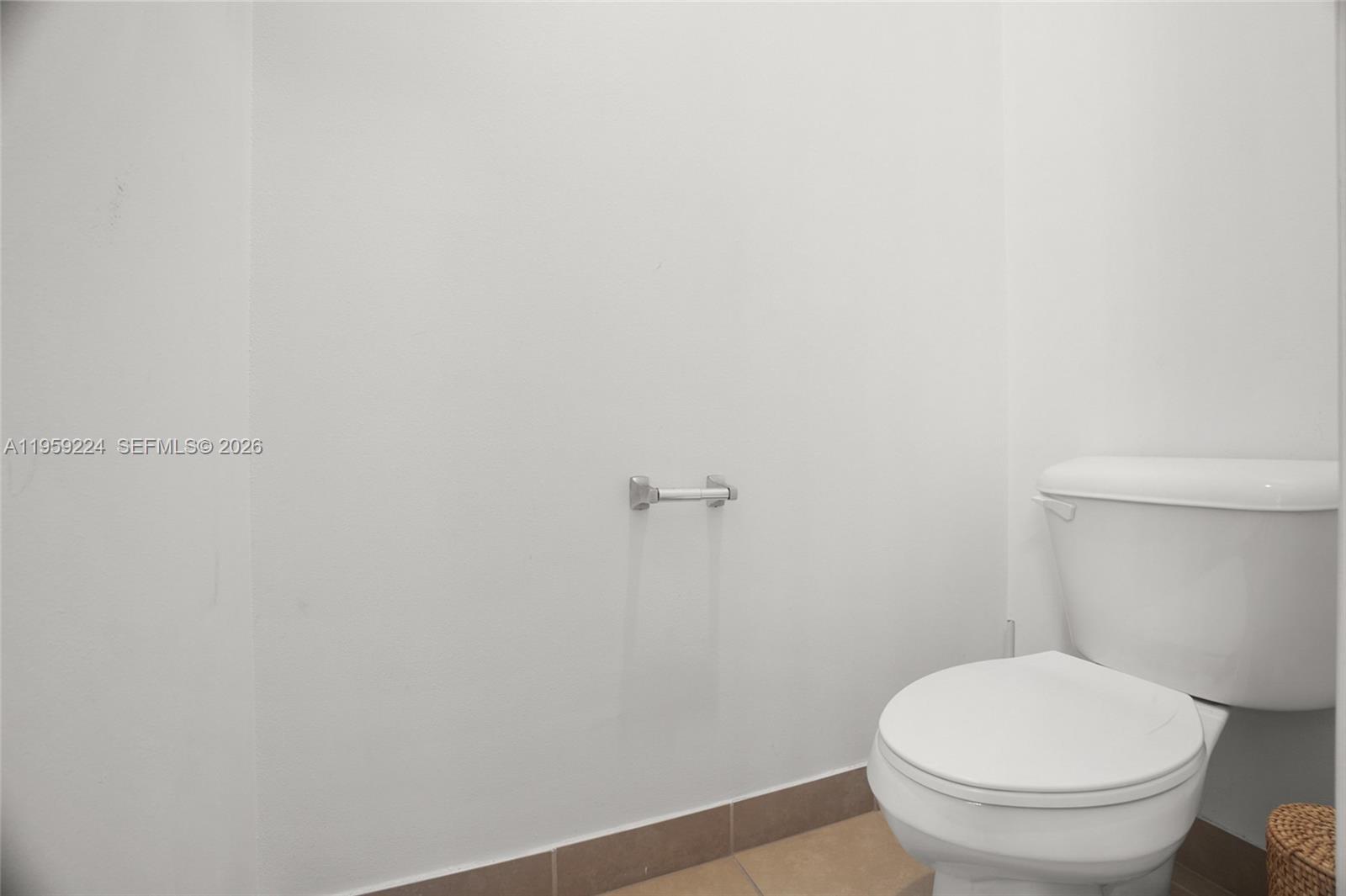 14774 Southwest 10th Street, Unit 10502 Pembroke Pines, FL 33027 - Photo 25 of 42 a white toilet sitting next to a white wall