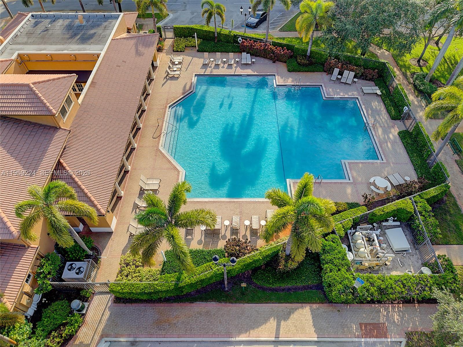 14774 Southwest 10th Street, Unit 10502 Pembroke Pines, FL 33027 - Photo 33 of 42 an aerial view of a house with a yard and potted plants