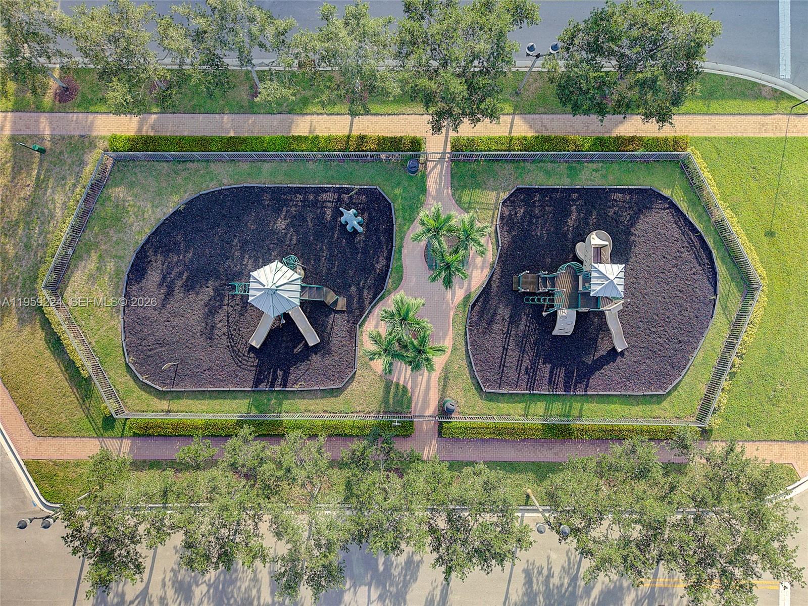 14774 Southwest 10th Street, Unit 10502 Pembroke Pines, FL 33027 - Photo 36 of 42 an aerial view of a house with garden space and a swimming pool