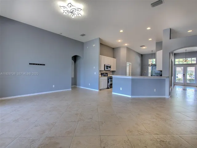 a view of a livingroom with a kitchen
