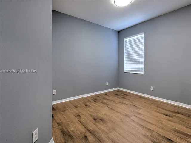 a bathroom with a sink toilet a mirror and shower