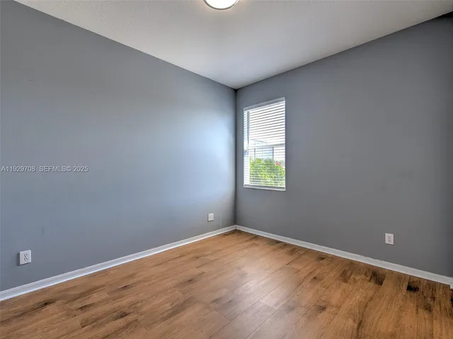 a bathroom with a sink toilet and a mirror