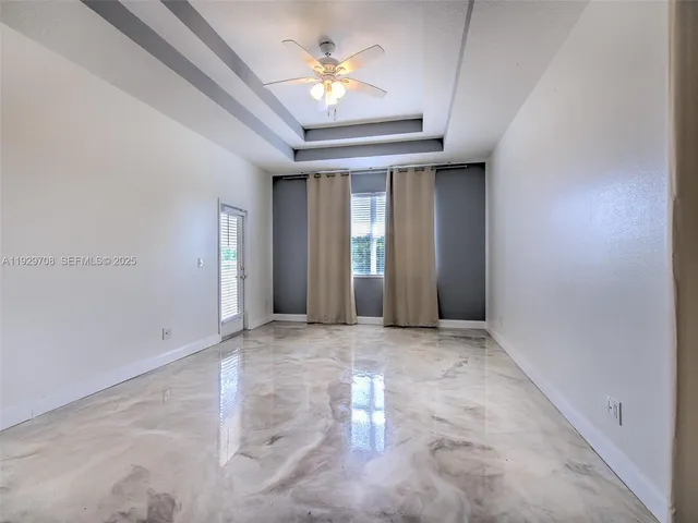 a view of a bathroom with a bathtub and a shower