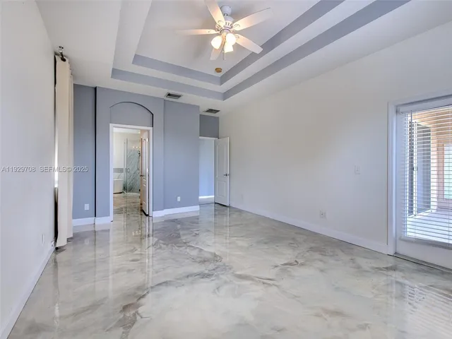 a large bathroom with a tub sink shower and mirror