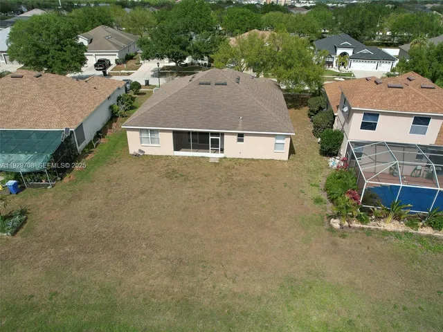 an aerial view of residential house with outdoor space