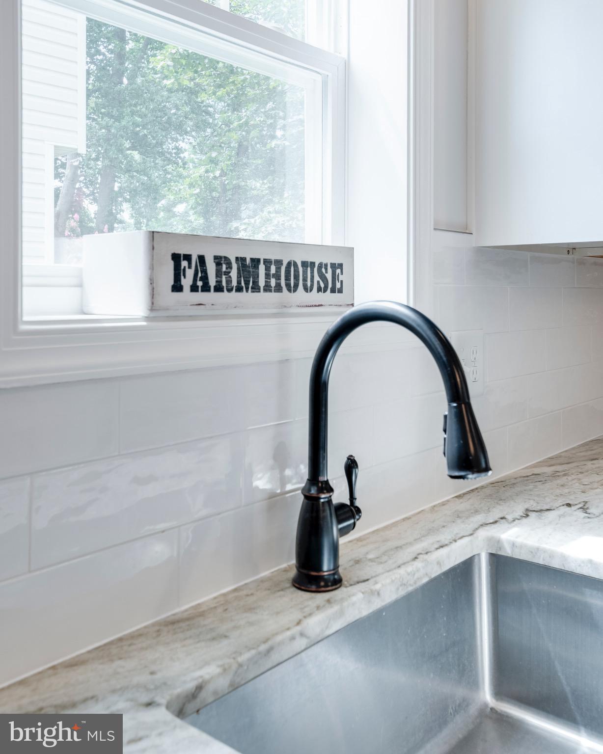 1724 Tacoma Road Edgewater, MD 21037 - Photo 19 of 81 a close view of a faucet a sink and a window