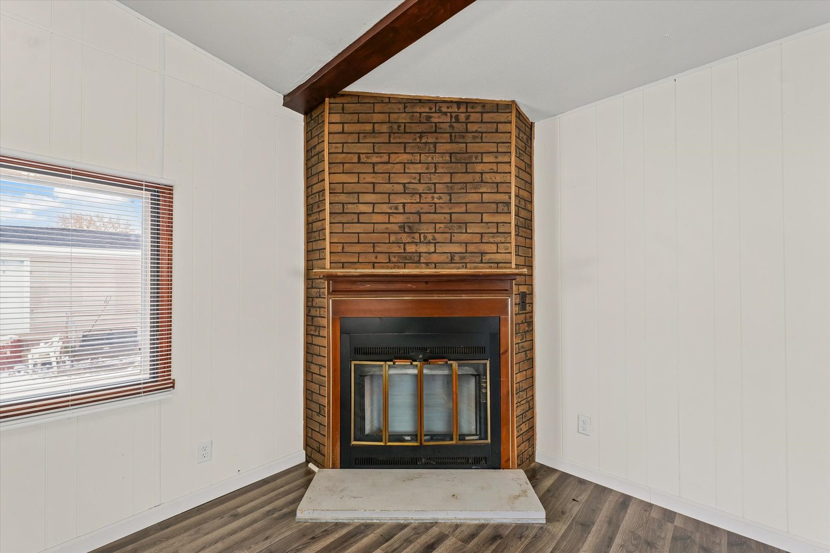 1221 Brookshire Drive, Unit 1221 Rantoul, IL 61866 - Photo 11 of 30 a view of an empty room with wooden floor and a window