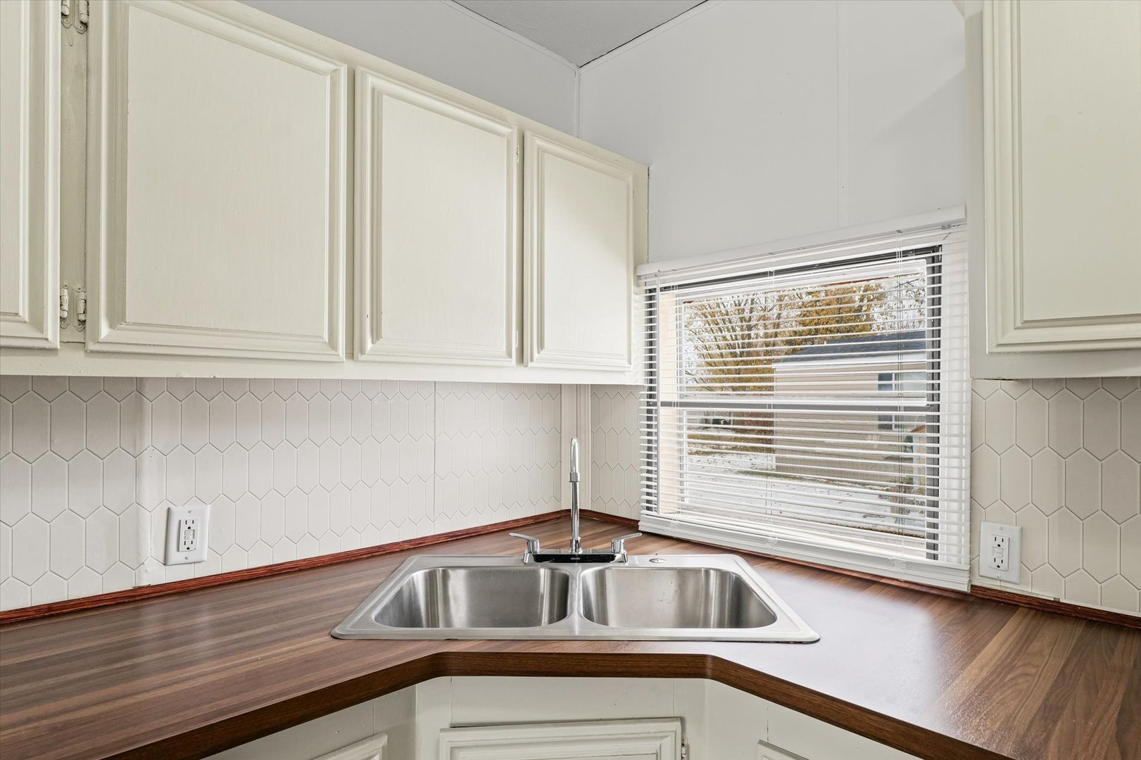 1221 Brookshire Drive, Unit 1221 Rantoul, IL 61866 - Photo 17 of 30 a kitchen that has a sink and cabinets