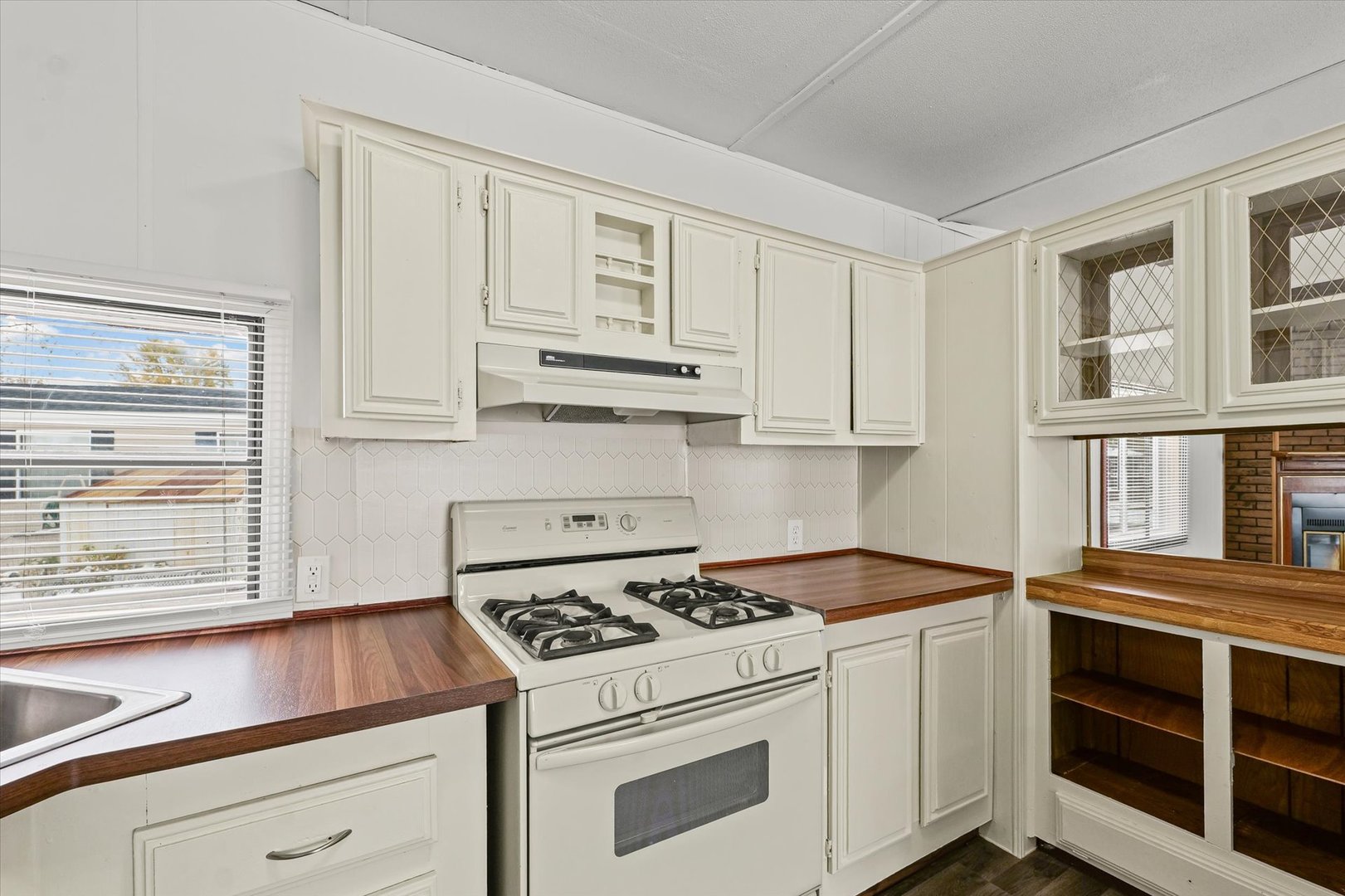 1221 Brookshire Drive, Unit 1221 Rantoul, IL 61866 - Photo 18 of 30 a kitchen with cabinets appliances and a window