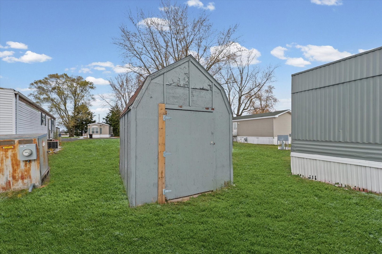 1221 Brookshire Drive, Unit 1221 Rantoul, IL 61866 - Photo 26 of 30 a view of a house with a yard