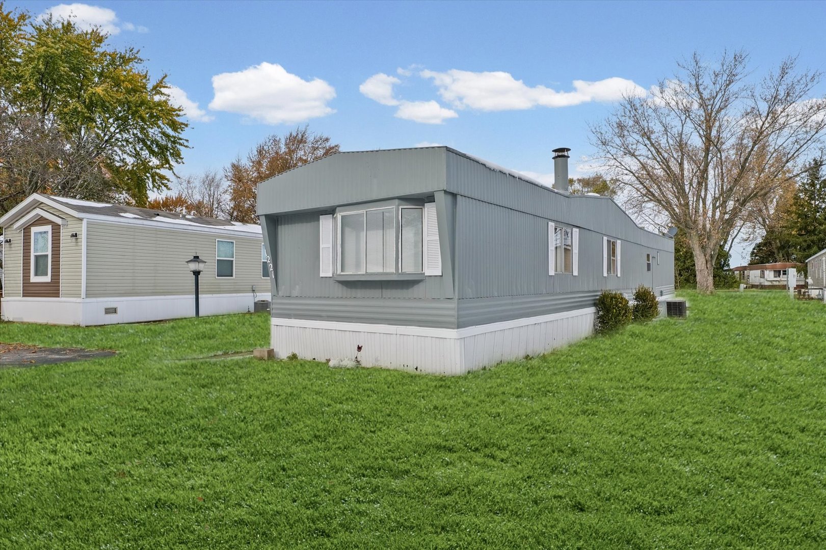 1221 Brookshire Drive, Unit 1221 Rantoul, IL 61866 - Photo 4 of 30 a front view of house with yard and green space