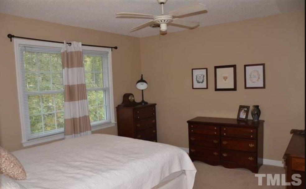 5708 Partridge Lane Raleigh, NC 27609 - Photo 22 of 27 a bedroom with a bed and a window