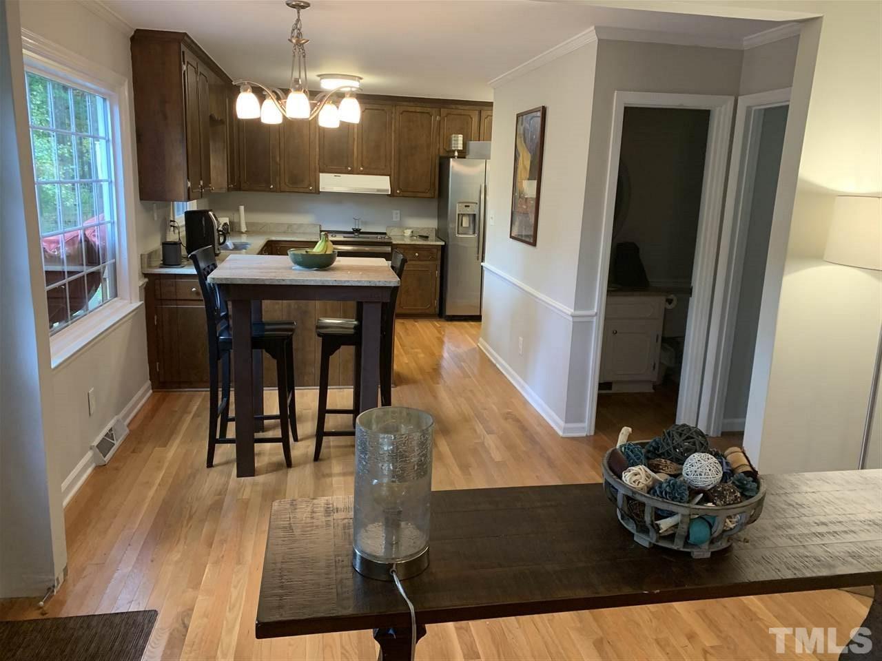5708 Partridge Lane Raleigh, NC 27609 - Photo 8 of 27 a dining room with furniture and wooden floor