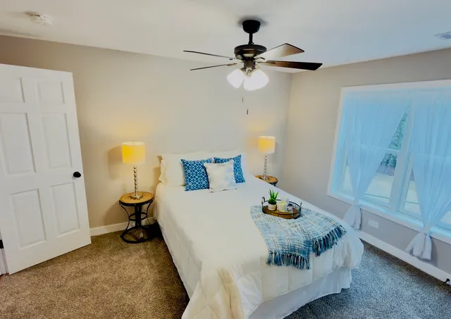 a bedroom with a bed and dresser