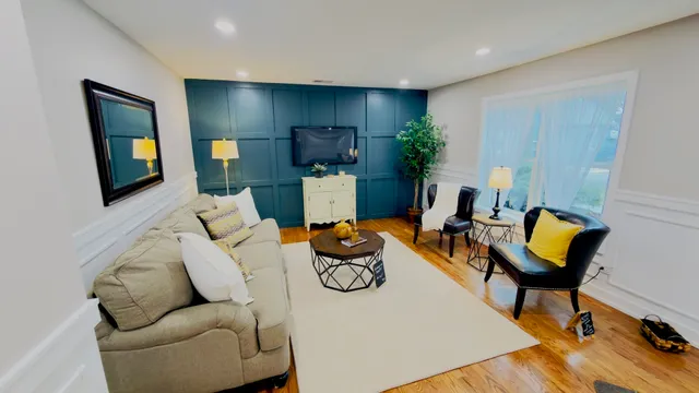 a living room with furniture and a flat screen tv