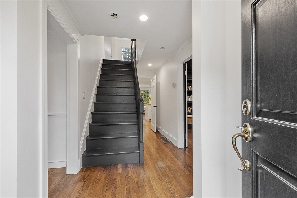 90 Coolidge Road Concord, MA 01742 - Photo 14 of 42 a view of entryway and hall with wooden floor