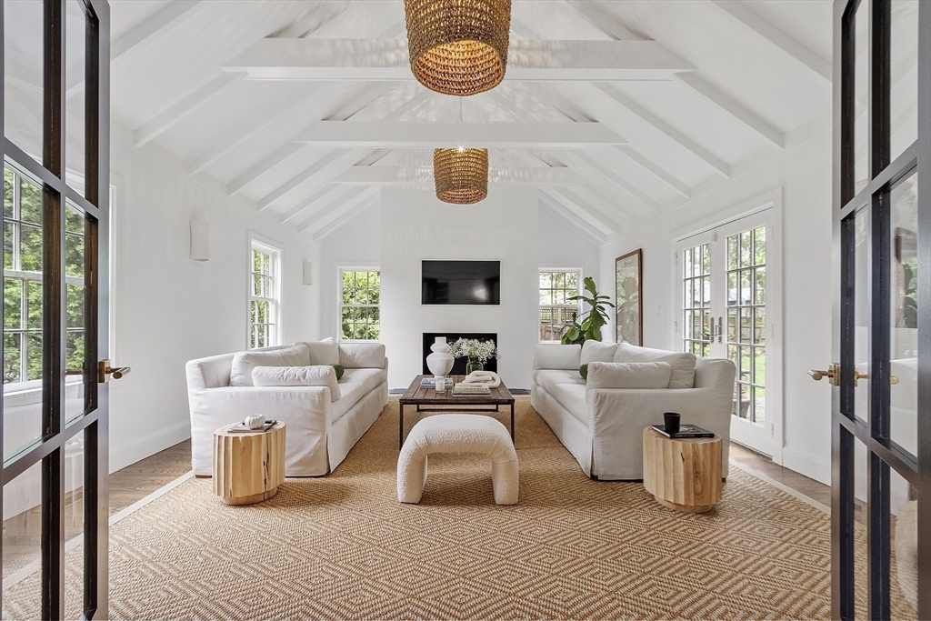 90 Coolidge Road Concord, MA 01742 - Photo 2 of 42 a living room with furniture and a fireplace