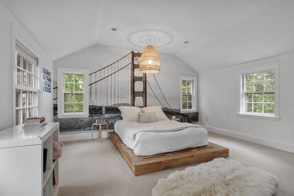 90 Coolidge Road Concord, MA 01742 - Photo 21 of 42 a bedroom with a bed window and couch