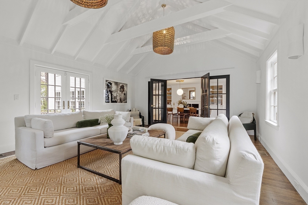 90 Coolidge Road Concord, MA 01742 - Photo 27 of 42 a living room with furniture and a large window