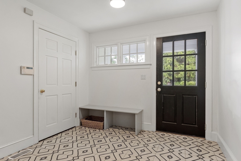 90 Coolidge Road Concord, MA 01742 - Photo 34 of 42 a view of an entryway with a window
