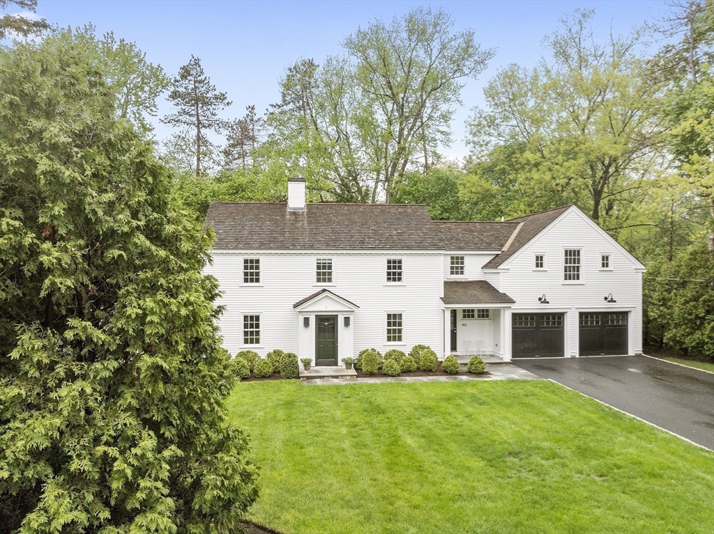 90 Coolidge Road Concord, MA 01742 - Photo 41 of 42 a view of a white house with a yard