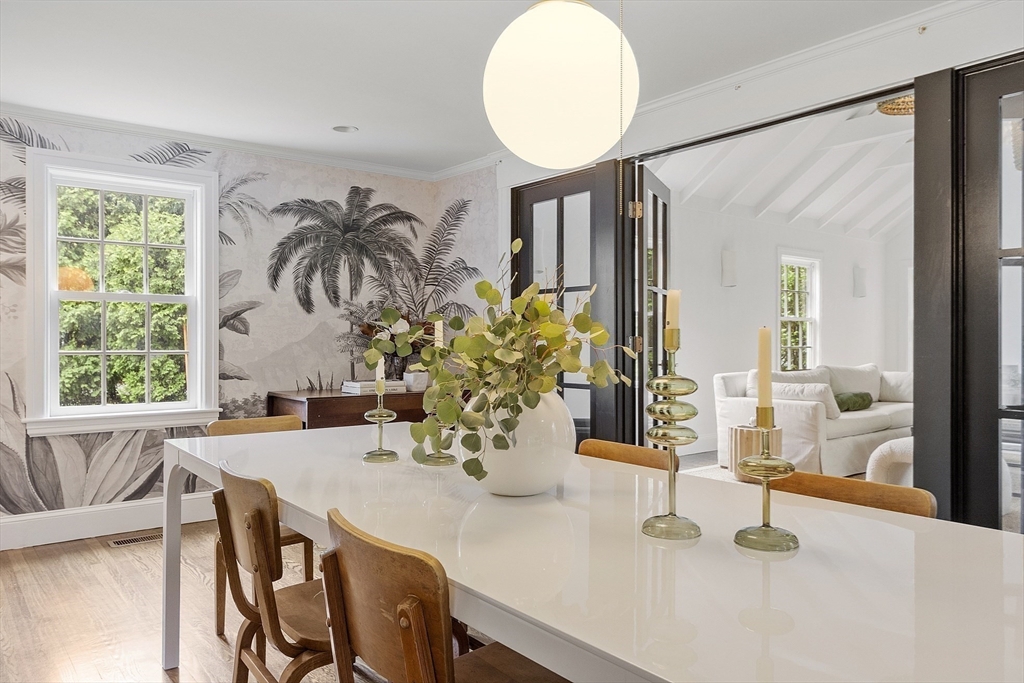 90 Coolidge Road Concord, MA 01742 - Photo 7 of 42 a dining room with furniture and wooden floor