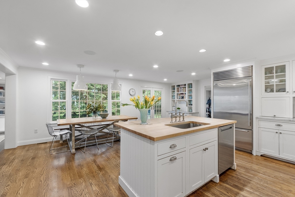 90 Coolidge Road Concord, MA 01742 - Photo 8 of 42 a kitchen with a sink appliances and wooden floor
