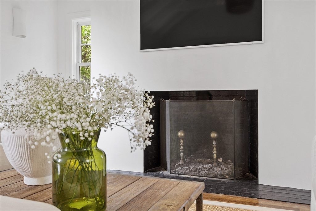 90 Coolidge Road Concord, MA 01742 - Photo 10 of 42 a vase of flowers sitting on a table