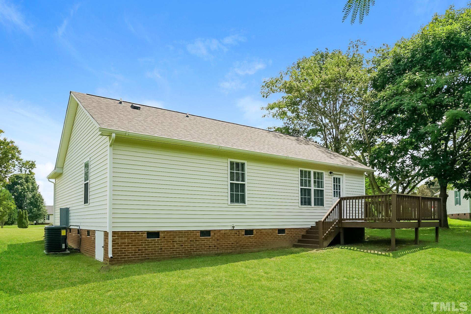 110 Impressive Lane Clayton, NC 27520 - Photo 16 of 16 a view of a house with a backyard