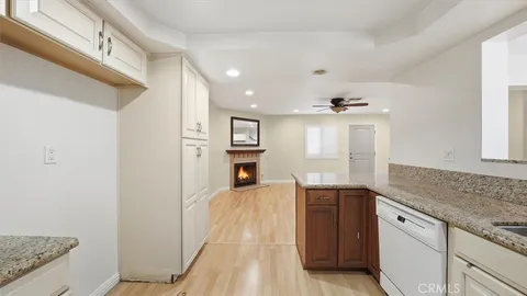 a spacious bathroom with a granite countertop sink and a mirror